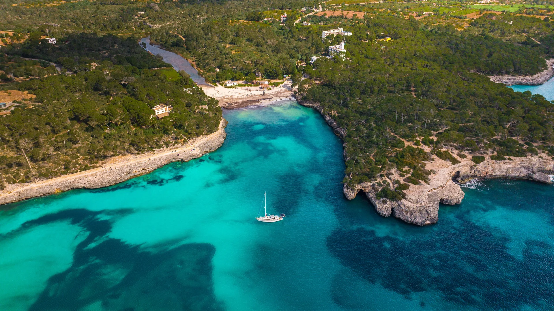 Aerial view of a rocky cove with turquoise water in Mallorca